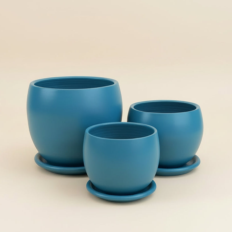 Set of teal curvy clay plant pots with saucers in different sizes