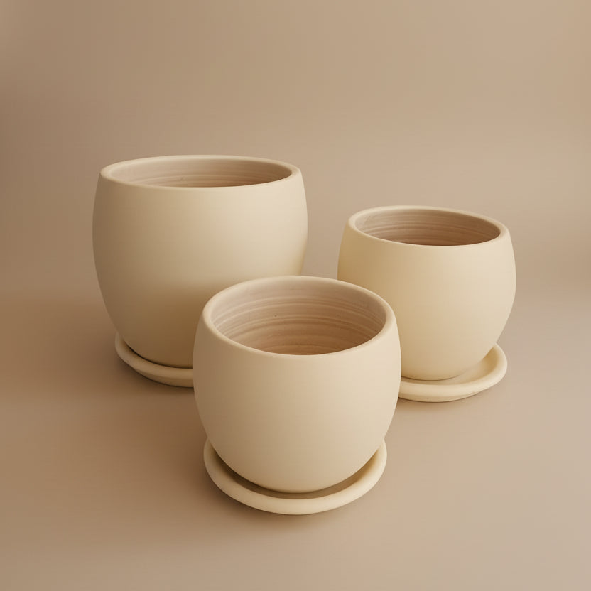 Ivory beige curvy clay planter set with saucers in multiple sizes