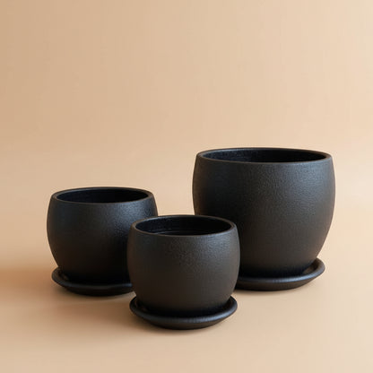 Set of Black textured curvy clay plant pots with saucers in different sizes 