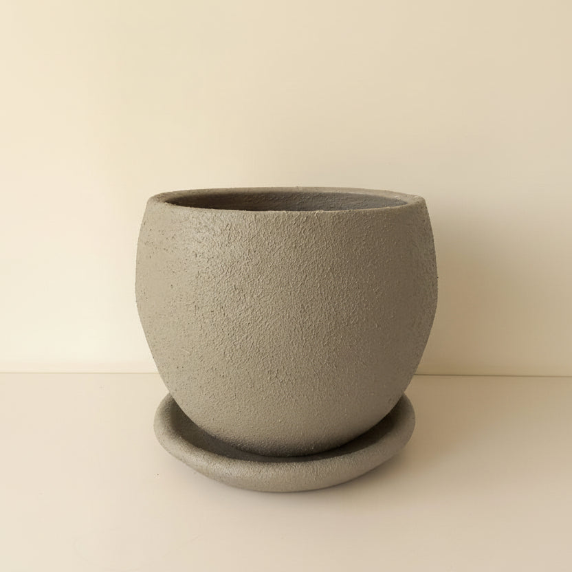 Grey textured curvy clay plant pot with saucer, 25cm, also available in 30cm and 40cm, stone grey tone